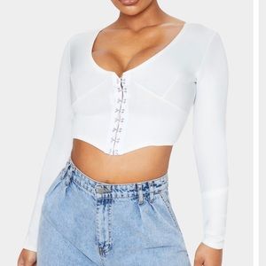 White scuba hook and eye pointed hem crop top